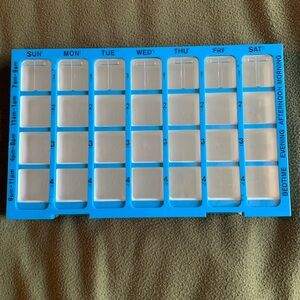 Medication organizer. Approximately 12 1/2” x 8” x 1 1/2”